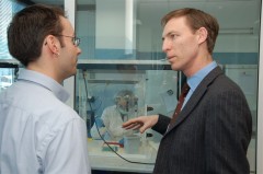 Rene Huel, Head of ICMP DNA Laboratories explains the DNA identification proces to the United Kingdom Minister for Europe, Mr. Jim Murphy